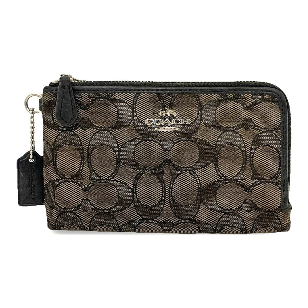 the Coach Corner Pouch wallet in Signature Canvas 64370 Brown Black